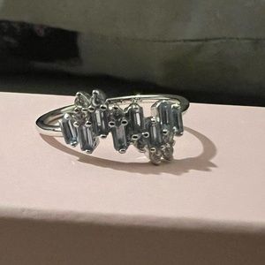 Lab created Montana blue sapphire. Rhodium plating. Size 7.